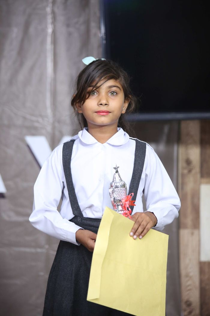 A Maranatha pupil holding a prize at the 2022 annual result