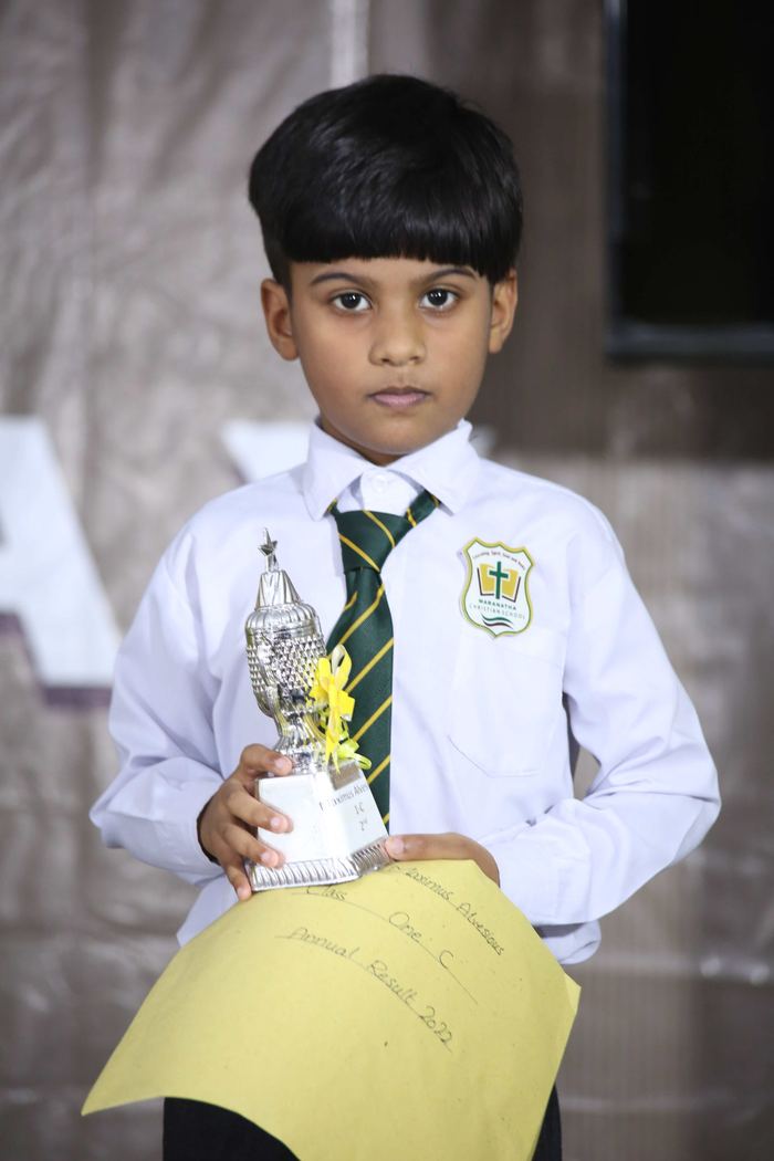 A Maranatha pupil holding a prize at the 2022 annual result