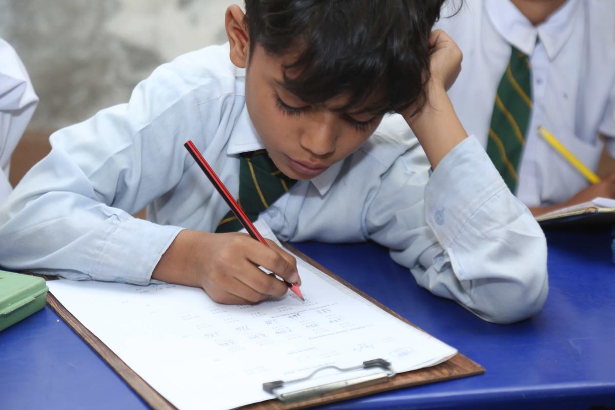 A Maranatha pupil concentrating on his written work