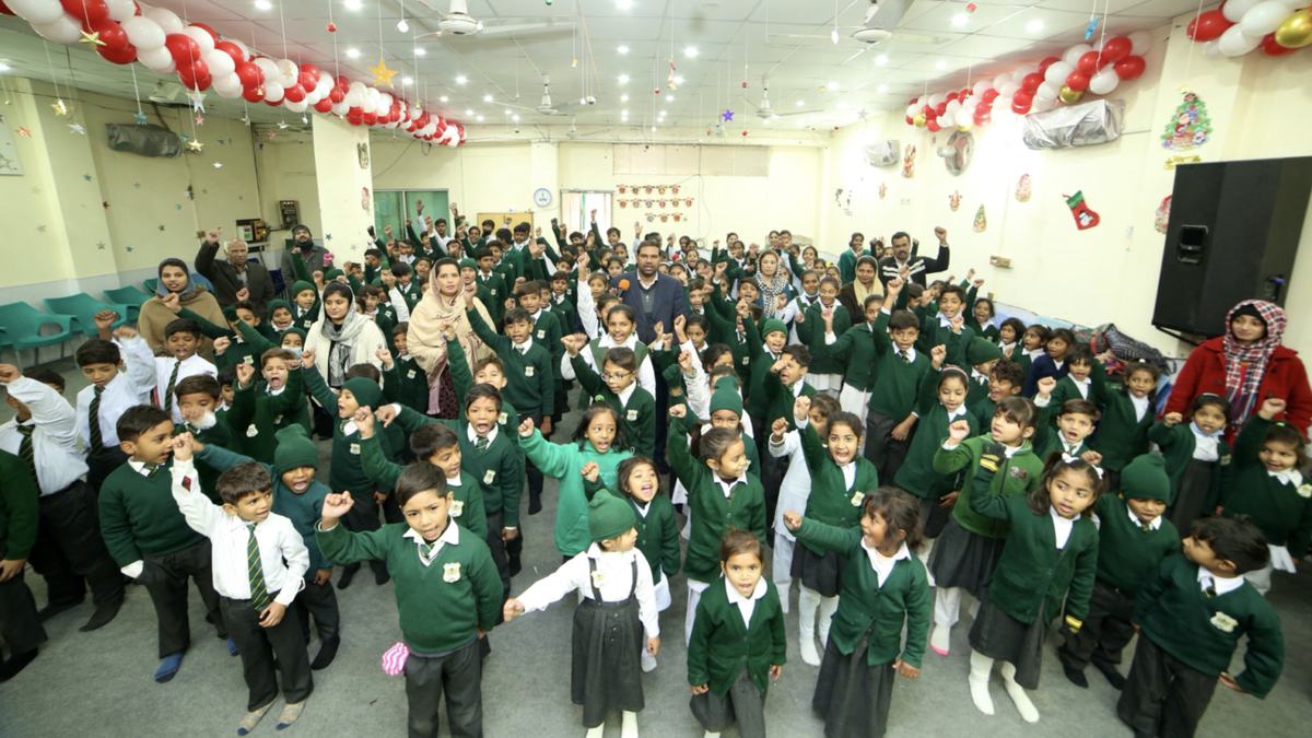 Pupils and parents at a school celebration