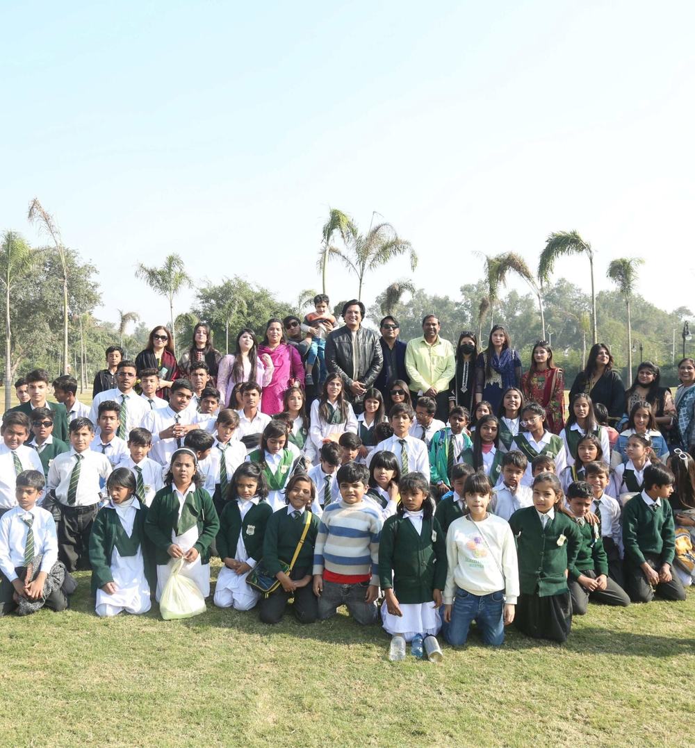 Pupils and teachers of Maranatha Christian School gathered outdoors in Lahore
