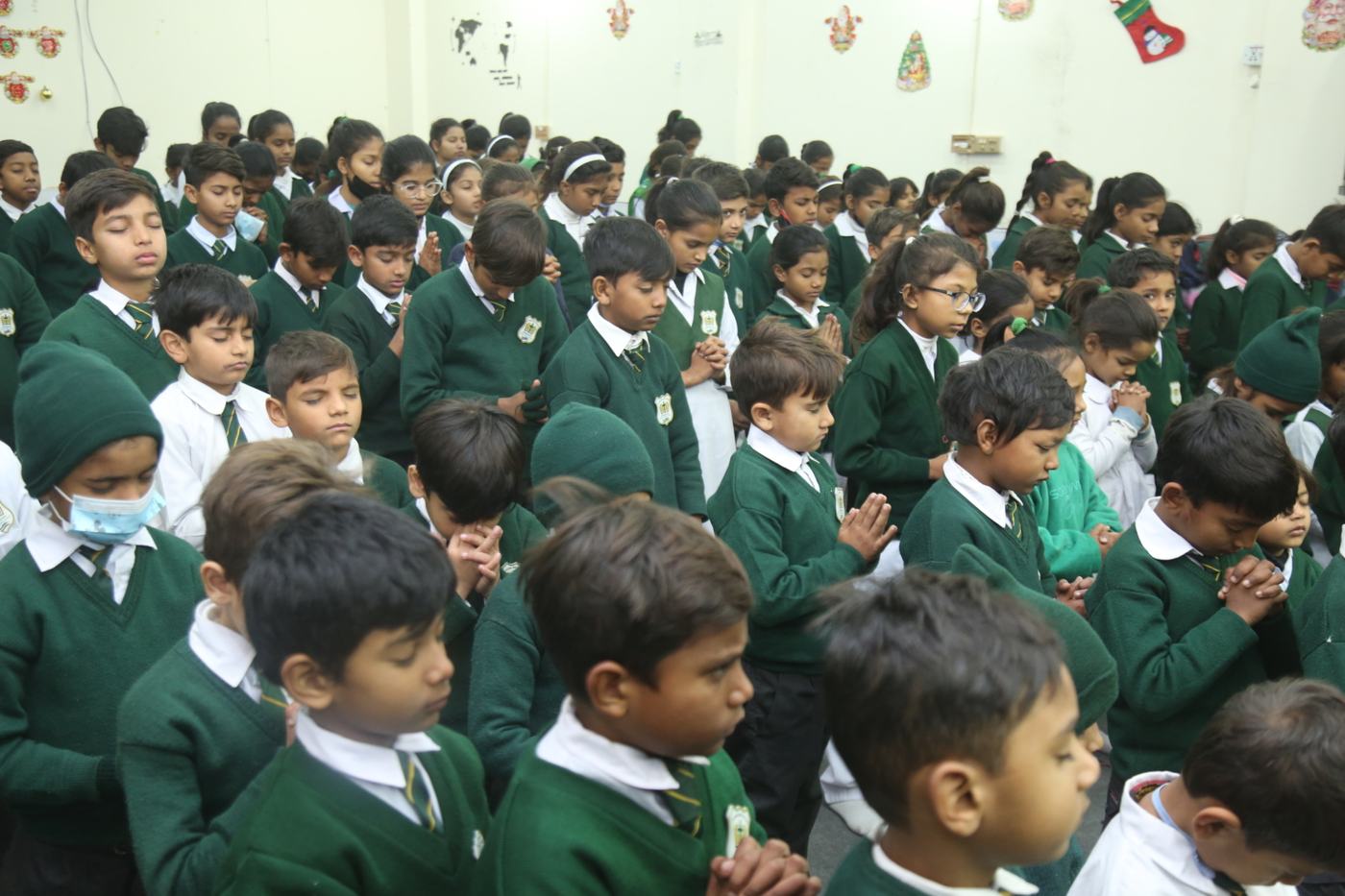 Young Maranatha pupils in their green school sweaters